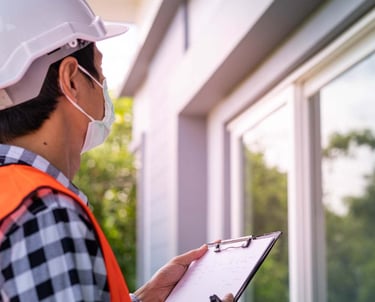 a man in a helmet and a helmet on a clipboard