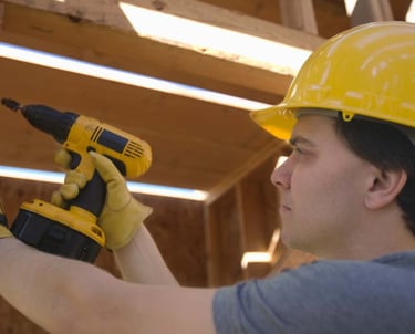 a man in a hard hat and a yellow helmet