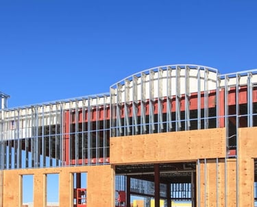 a building with a clock tower in the foreground