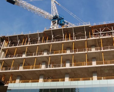 a crane is standing in front of a building