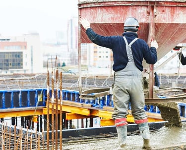 a man in a construction site with a crane