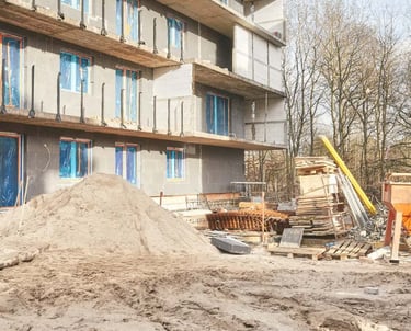 a pile of rubble and rubble in front of a building