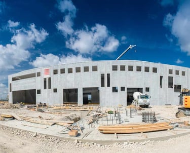 a construction site with a construction crane and a construction worker