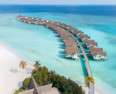 Luxury resorts in Maldives with over water villas on crystal clear lagoon