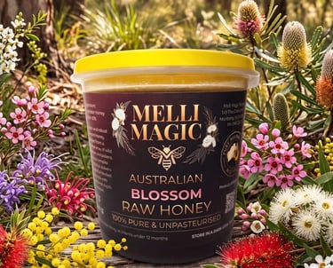 A tub of Melli Magic Australian Blossom Raw Honey surrounded by vibrant native wildflowers in a sunny forest.