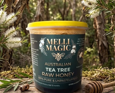 Melli Magic Australian Tea Tree Raw Honey jar on a rustic wood table in a flowering tea tree forest.