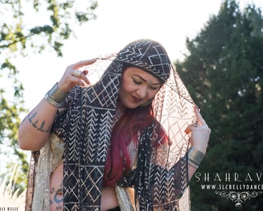 Bellydancer Shahravar in vintage Assuit costume drape