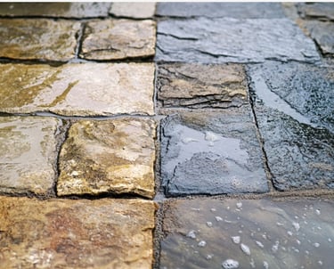 Before and After image of Stone pavers pressure washed and sealed
