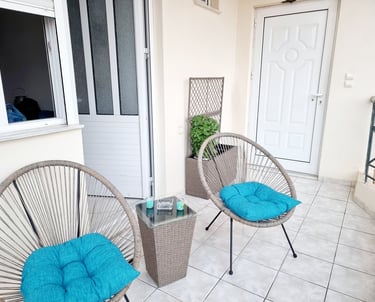 a patio with a chair and a table
