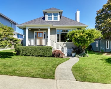a house with a walkway and a walkway leading to a house