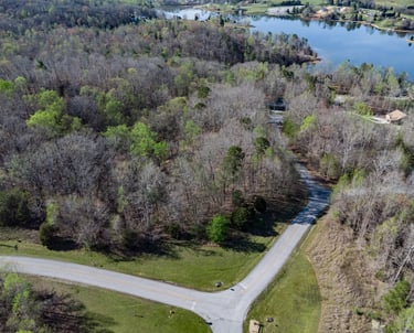 Aerial drone image of raw land and lake.