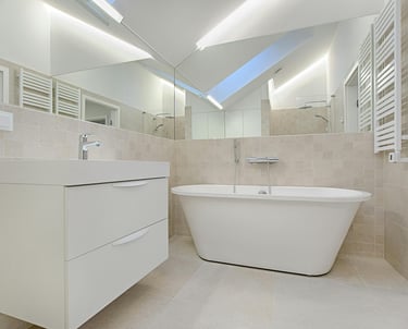a bathroom with a bathtub and a skylight