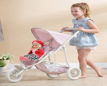 a little girl in a blue dress and a doll doll