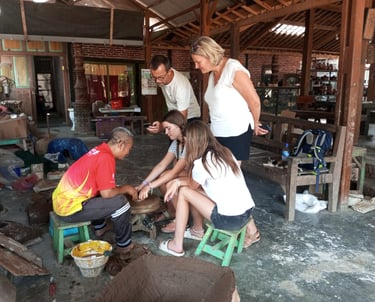 Artisan demonstrating traditional Pottery-making techniques in a Yogyakarta workshop.