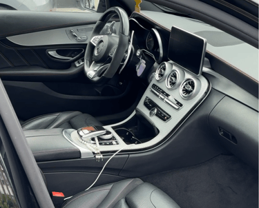 a car with a steering wheel and dashboard