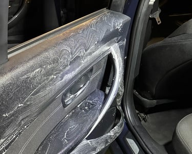 a car door with a door open and a car door open