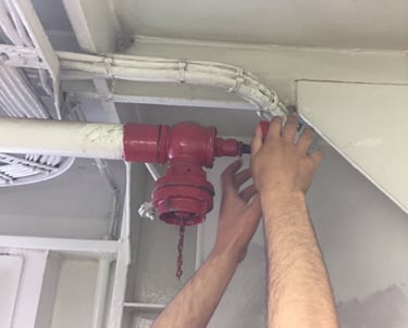 surveying a fire hydrant in a ship