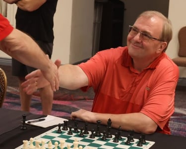 Vegas Chess Coach - Oliver Hemmers is shaking hands with his opponent in an OTB tournament.