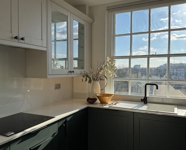 a kitchen with a sink and a beautiful view from the window
