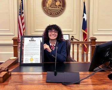 A woman holding a certificate in a court room