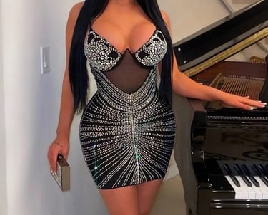 a woman in a dress with a piano