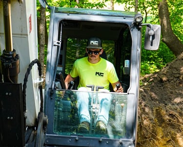 Patrick Kruse, Owner of Kruse Contracting, digging in an excavator
