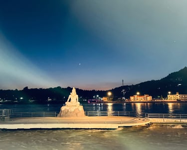 Lord Shiva statue on a pier at Parmarth Ashram in Rishikesh, overlooking the Ganges River