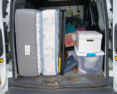 Van filled with decluttered items.  RevampT Spaces Organizing Services Decluttering near me