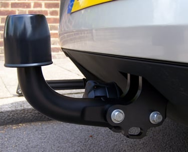 Close-up of towbar installation on a vehicle for enhanced towing capability and safety.