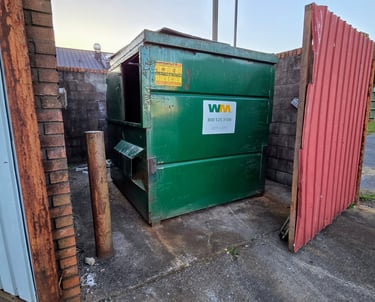 Image of a dumpster area that Guaranteed Junk Removal cleaned by removing all of the trash.