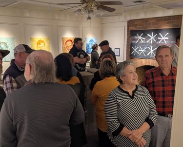 A group of people exploring the opening of the first 2026 gallery, Passports