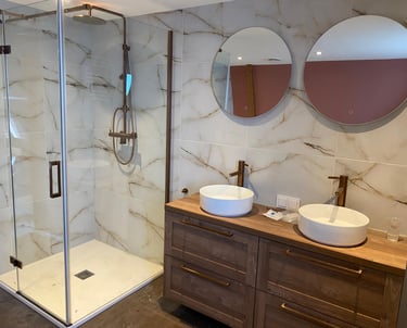 a bathroom with a shower and a sink