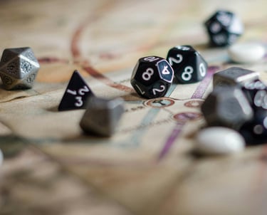 Close up of D20 dice sitting on top of a map from a tabletop game