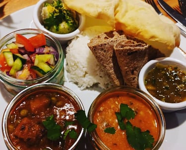 A thali plate full of indian food from a curry night at the ark northampton