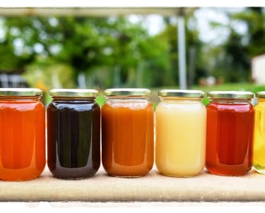 a row of jars of honeys and honeys