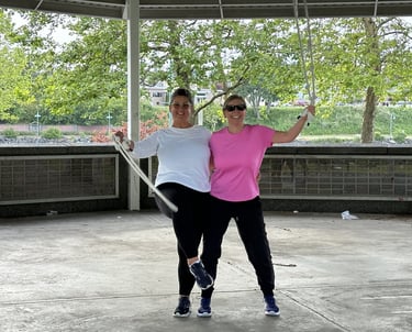 2 old women waving ropes smiling in fitness clothes