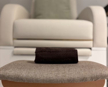 image of a stool, towel and a manicure chair