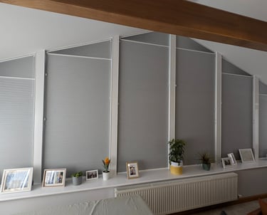 Shaped blackout honeycomb blinds fitted to angled windows in Aberdeen home