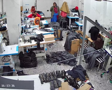 a group of people standing around a table with luggage