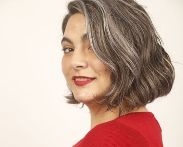 a woman with a red sweater and red lipstick