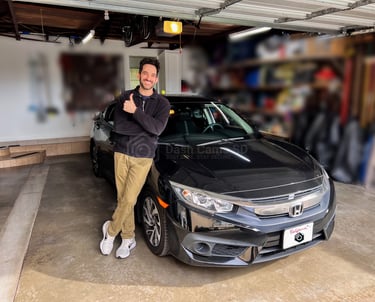 Guy standing in front of 2016 Honda Civic