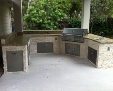a grilling area with a grill and a grill