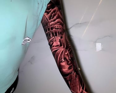 ustom full-arm sleeve tattoo on tourist at Legian studio