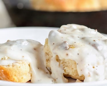 a plate sausage Biscuits and gravy
