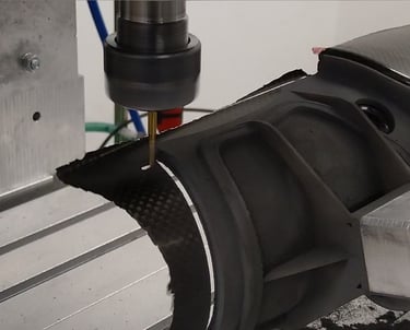 a cnc machine cutting carbon fibre