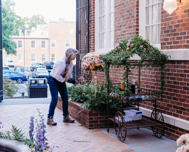 a woman standing in front of a building