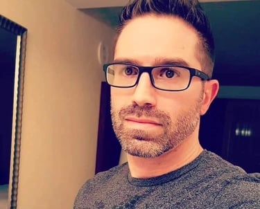 a man with glasses and a beard and a beard