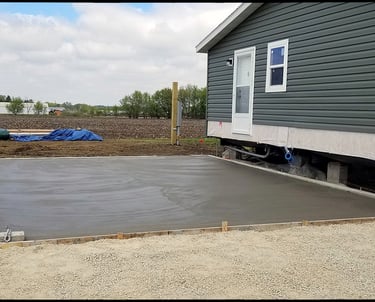 Concrete footings, poured concrete walls, and garage floors.