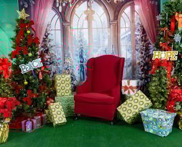 a christmas tree with presents and presents on a green background