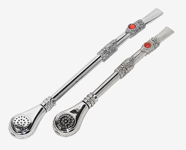 Two ornate silver bombilla straws for yerba mate tea featuring red stone accents.